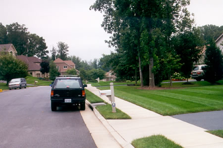 Turn right and follow the sidewalk along Bright Pond Rd.