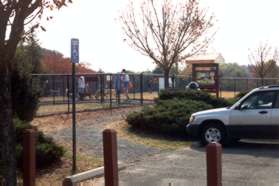 The entrance to the dog park is on the left of the parking area.