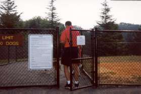 There are double gates on the entrance to the dog park.