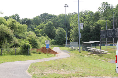 Follow the asphalt trail past the athletic field on the right.