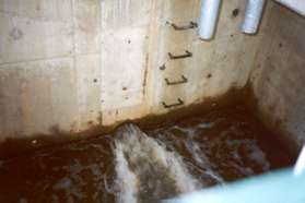 The inlet pipe for this basin is shown operating at full capacity hours after the rainfall.