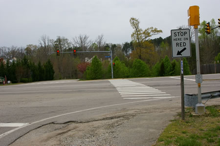 To continue on the next section of the CCT cross the Fairfax County Pwy using the walk light.