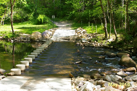 The trail crosses Pohick Creek on columns.