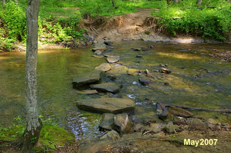 These rocks provide the crossing. There is one gap that may be difficult.