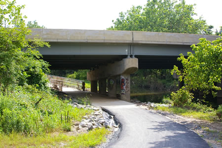 Follow the paved trail from the baseball field parking lot under the Rt. 236 ramp.