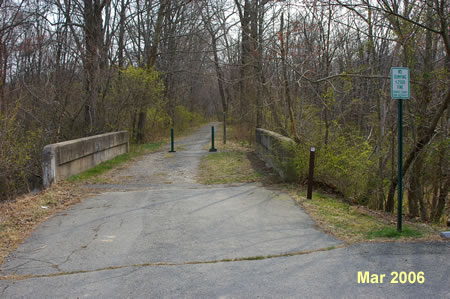 The trail starts at the far east end of the parking area.