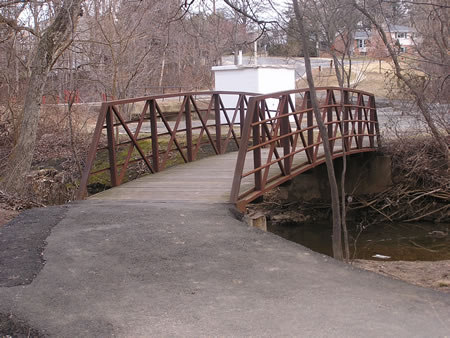 Another view of the bridge with the white building in the background.