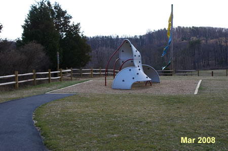 Walk down the asphalt trail on  the southeast side of the parking lot toward the play equipment.