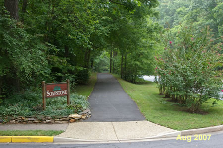 The path crosses an entrance to the Soapstone Cluster.  Continue straight to the Nature Center.