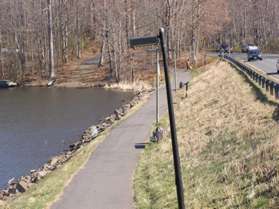 The trail crosses the dam at the end of Lake Anne.