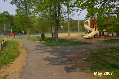 Turn right onto the asphalt trail prior to the slide.