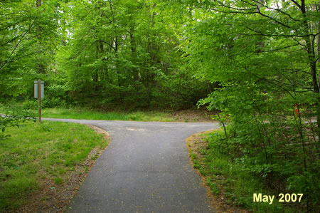 Turn right at the asphalt trail intersection.