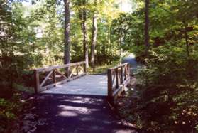 The trail crosses a small stream on a bridge.